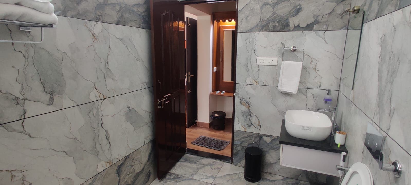 Bathroom looking through to the dressing area