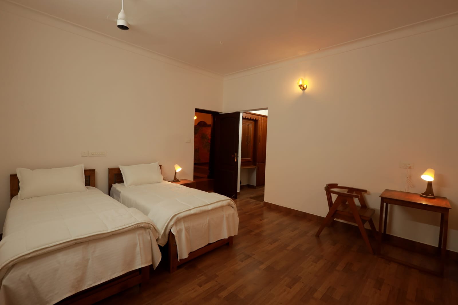 The Bamboo Room with two single beds dressed in white linen